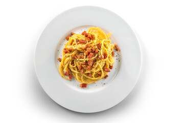 Plate of spaghetti carbonara with black pepper