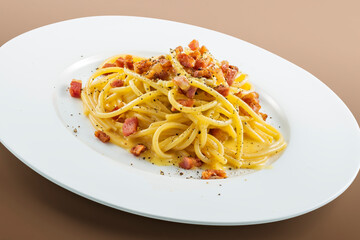 Plate of spaghetti carbonara with black pepper