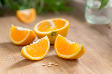 Freshly sliced organic orange on a wooden table