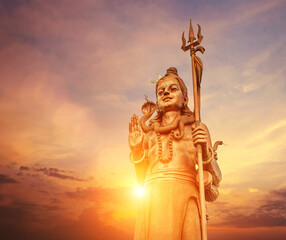 The huge Shiva statue Mangal Mahadev is a 33 m art piece in Ganga talao temple on the blue evening...