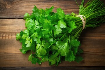 Top view of organic Italian parsley bunch on rustic wood table background.