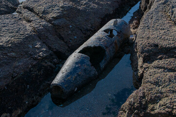 November 2022, the remains of a shell in sight before, dating from the Second World War in the reefs of the beach of La Sauzaie, Vendée FRANCE.