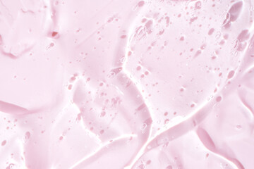Hyaluronic acid gel. Textured background with oxygen bubbles, pink background.
