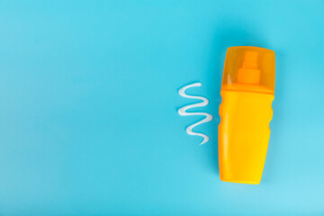 Sunscreen on an orange background. SPF cream. Sun protection. UV protection. Summer. The concept of rest and vacation. Summer mood. Design. MOCKUP. Shopping concept.