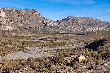 Traveling the famous Ruta40 in the scenic Argentinian highlands - fantastic views while driving through colorful and remarkably shaped mountains and watching wildlife in high altitude in South America