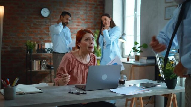 Angry businesswoman arguing with boss at work in office