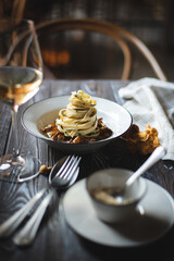 Appetizing Italian pasta with mushrooms. Food photography. Stylish serving of food.