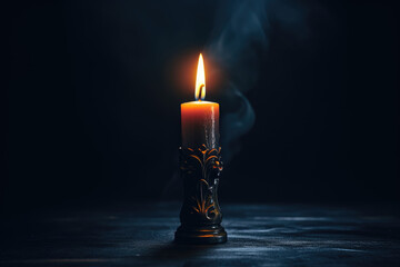 Close-up of a single unlit candle in a dark room.