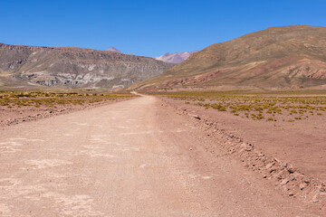 Traveling the famous Ruta40 in the scenic Argentinian highlands - fantastic views while driving through colorful and remarkably shaped mountains and watching wildlife in high altitude in South America