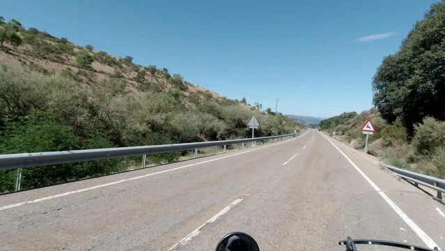 Riding a classic custom motorcycle on an asphalt road, riding a motorcycle in summer, first person view, 2k video