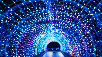 holiday illumination and decoration concept - christmas garland bokeh lights over dark blue...