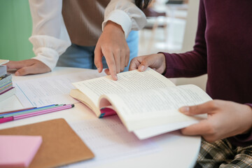 Learning with friends Young students campus.High School Tutor for examining helps school homework together with friend catching up and learning