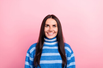 Photo of lovely cheerful young lady beaming smile look interested up above empty space isolated on pink color background