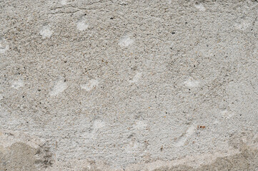 The background of an old wall decorated with gray cement mortar