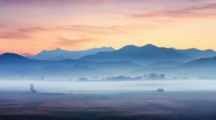 Landscape with mist covering the fields with beautiful mountains in the morning, fog, mountains, fields