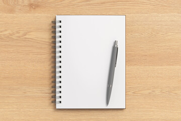 Notebook mockup. Opened blank notebook and pen. Spiral notepad on wooden background