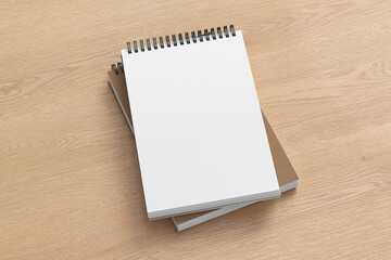 Notebook mockup. Two notebooks in a stack. Spiral notepad on wooden background