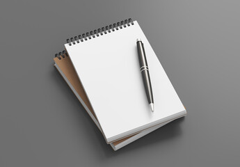 Notebook mockup. Two notebooks in a stack and pen. Spiral notepad on gray background