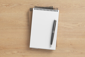 Notebook mockup. Two notebooks in a stack and pen. Spiral notepad on wooden background