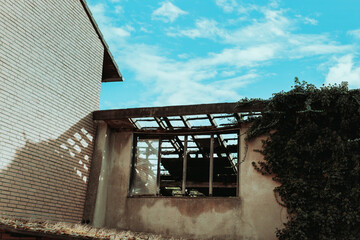 Abstract photo of an abandoned building with greenery