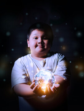 Boy holding crystal earth of data network,