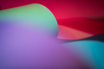 Colorful abstract paper texture background. Curled sheets of paper. Oval shape. Macro photography. ...