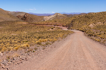 Traveling the famous Ruta40 in the scenic Argentinian highlands - fantastic views while driving through colorful and remarkably shaped mountains and watching wildlife in high altitude in South America