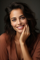 Fototapeta premium Beautiful smiling woman touching face with hand
