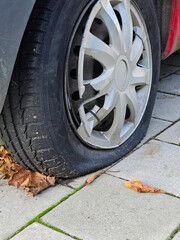Damaged tire and rim after hovering into the curb in the city center, Lodz, Poland.