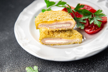cordon bleu fresh cutlet chicken meat, cheese, bacon appetizer meal food snack on the table