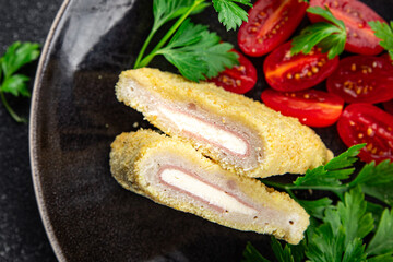 cordon bleu fresh cutlet chicken meat, cheese, bacon appetizer meal food snack on the table
