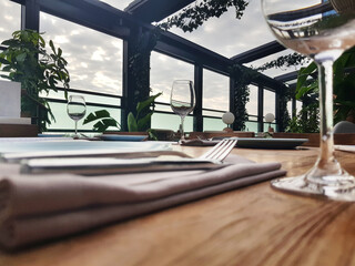 Part of restaurant interior with dishes closeup