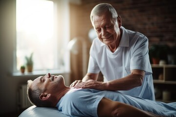 Orthopedic nurse stretching spinal cord and shoulder of elder patient with injury for physiotherapy. - Powered by Adobe