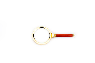 Magnifying glass. Magnifying glass with gold-plated handle. On a white background.