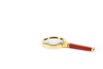 Magnifying glass. Magnifying glass with gold-plated handle. On a white background.