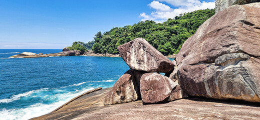 Beach Caxadaco with stones and transparent sea at island Ilha Grande, Rio de Janeiro, Brazil