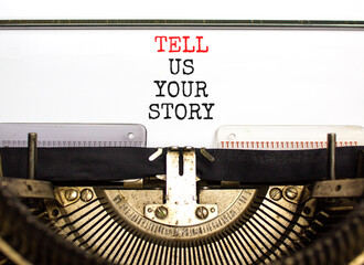 Tell us your story symbol. Concept word Tell us your story typed on beautiful old retro typewriter. Beautiful white paper background. Business tell us your story concept. Copy space.