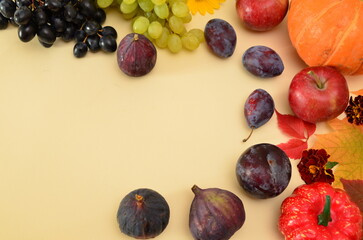 Assortment of fruits, grapes and nuts. Autumn seasonal harvest. pumpkin apples, red, yellow leaves. food still life with season fruits. Thanksgiving day, Halloween decoration fall design