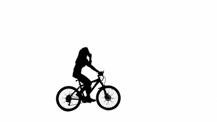 Portrait of female model. Black silhouette of girl answering to a call on smartphone riding a bike. Isolated on white background alpha channel.
