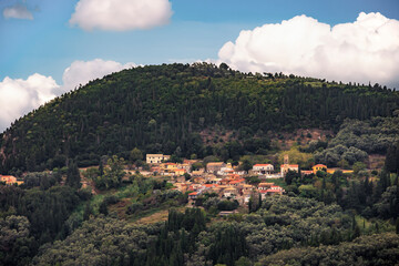Fototapeta na wymiar Mountain village in the north of the island of Corfu between wooded mountains and olive plantations