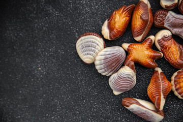 seashell candy chocolate sweet seashells dessert eating meal food snack on the table copy space food background rustic top view