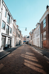 Typical historic town street in Zwolle in the east of the Netherlands. Exploring Dutch cities during daytime