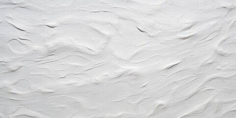 Obraz premium A close up view of a white wall with paint splatters. This image can be used for interior design, home improvement, or artistic projects