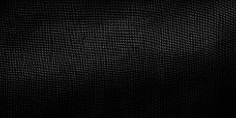 A detailed close-up view of a black cloth. This image can be used for various purposes such as fashion, textile, or interior design projects.