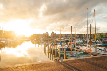 Sunset at the harbour in Almere, central Netherlands. Water transport during the golden hour