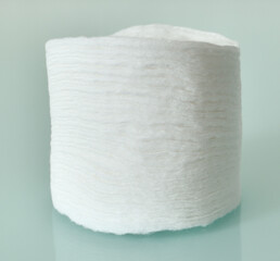 Stack of Cotton disks on light blue background