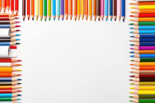 Many colored pencils on isolation. Pencils on white background,a rainbow colored frame with pencils and other school.