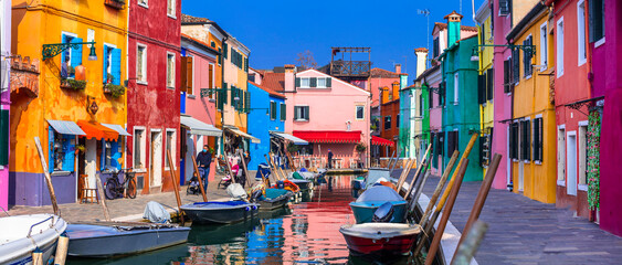 Italy travel and landmarks. Most colorful places (towns) - Burano island, village with vivid houses...