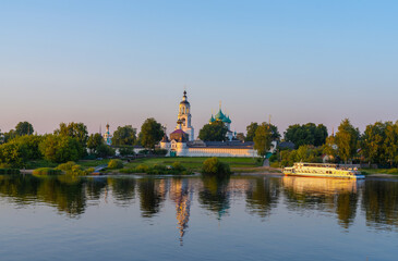 Fototapeta na wymiar View of the Tolga Monastery from the Volga River during sunset