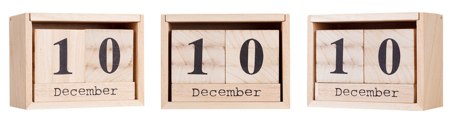 Wooden calendar, a set of dates of the month 10 December, on a white and transparent background close-up